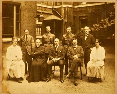 Photograph of the St George's Hospital residential house staff, with two of the Medical School's first female students, 1917